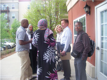 Diane Hofstede, George Sherman (Bottineau Commons owner) and community members 